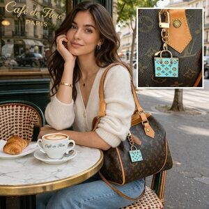 Authentic stamped Louis Vuitton Mini
Bag Charm/Keychain Tiffany Blue & Gold
EUC